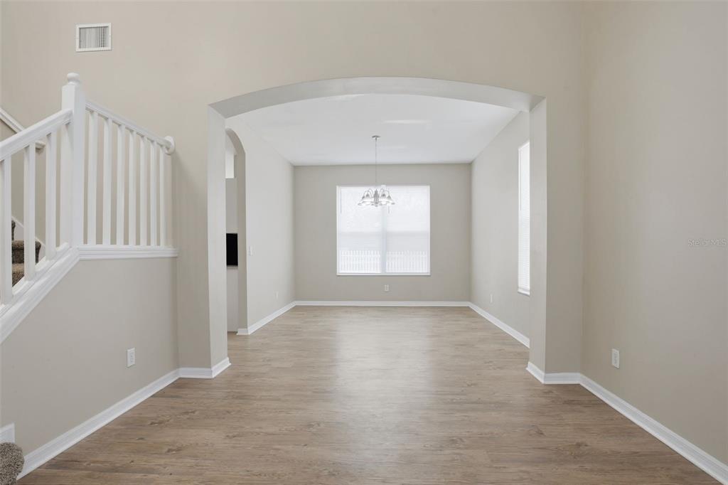 27001 Arrowbrook Way Wesley Chapel, FL 33544 - Photo 7 of 44 wooden floor in an empty room with a window