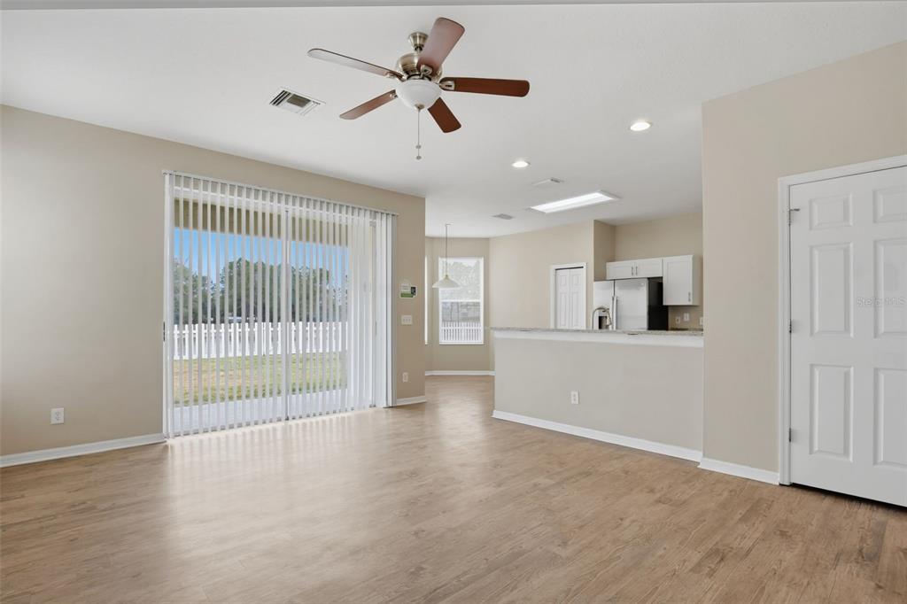 27001 Arrowbrook Way Wesley Chapel, FL 33544 - Photo 10 of 44 an empty room with wooden floor and windows