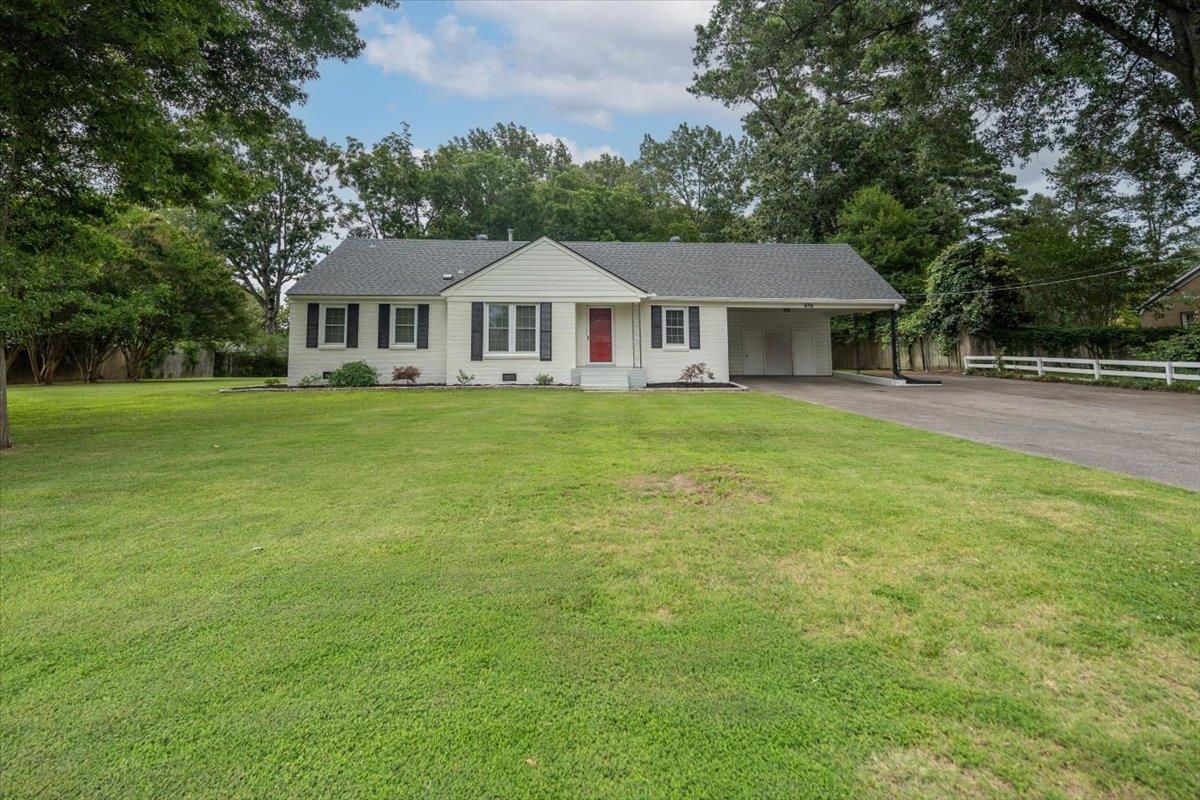 670 Peterson Lake Road Collierville, TN 38017 - Photo 22 of 37 White exterior residence with a dark shingle roof and black shutters