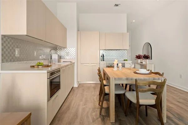 a bedroom with a bed and a potted plant