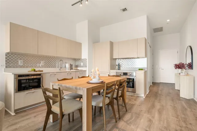 a room with a mirror and a wooden floor