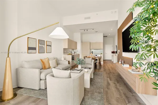 a bathroom with a granite countertop sink mirror and shower
