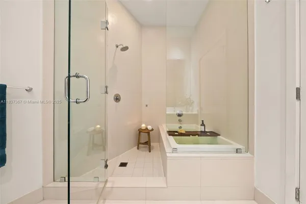 a view of a patio with a table and chairs next to a yard