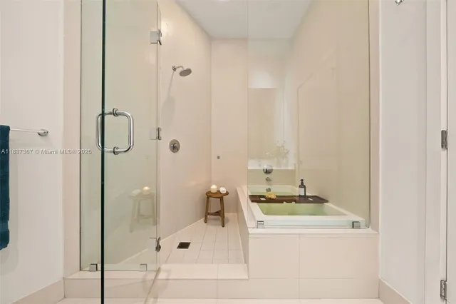 a view of a patio with a table and chairs next to a yard