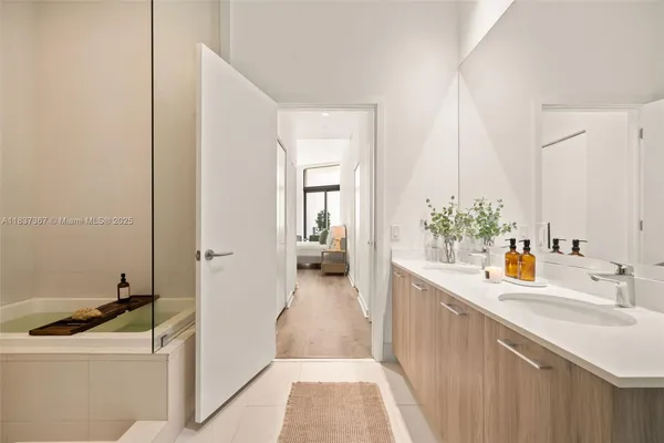 a view of a swimming pool with a patio and a yard