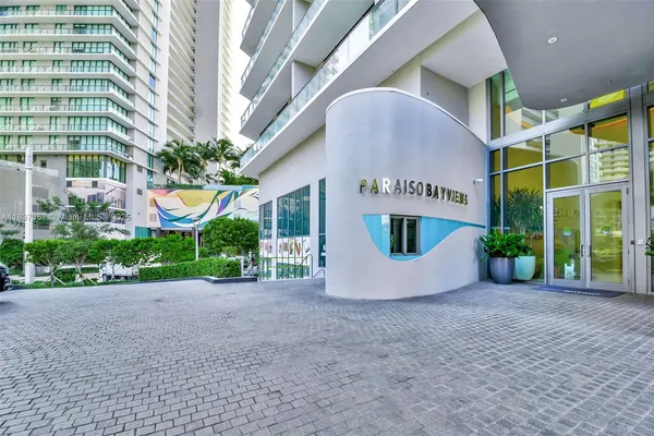 a view of living room with furniture and floor to ceiling window