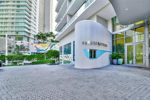 a view of living room with furniture and floor to ceiling window