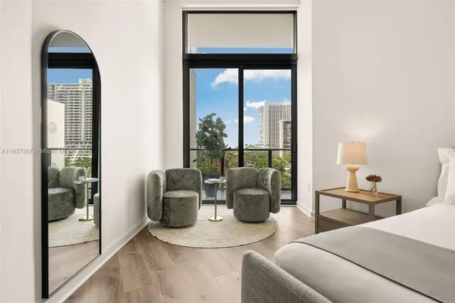 a kitchen with sink refrigerator dining table and chairs