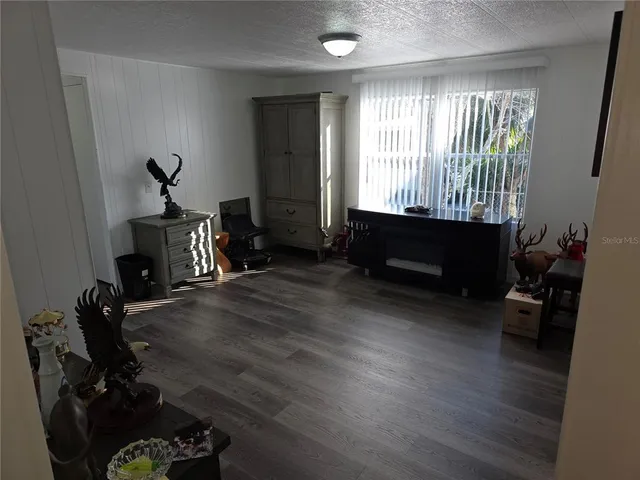 a living room with furniture window and gym equipment