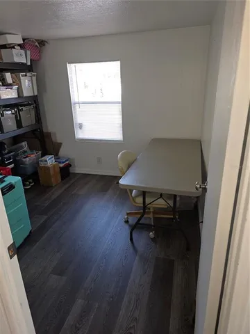 a workspace with furniture and a window