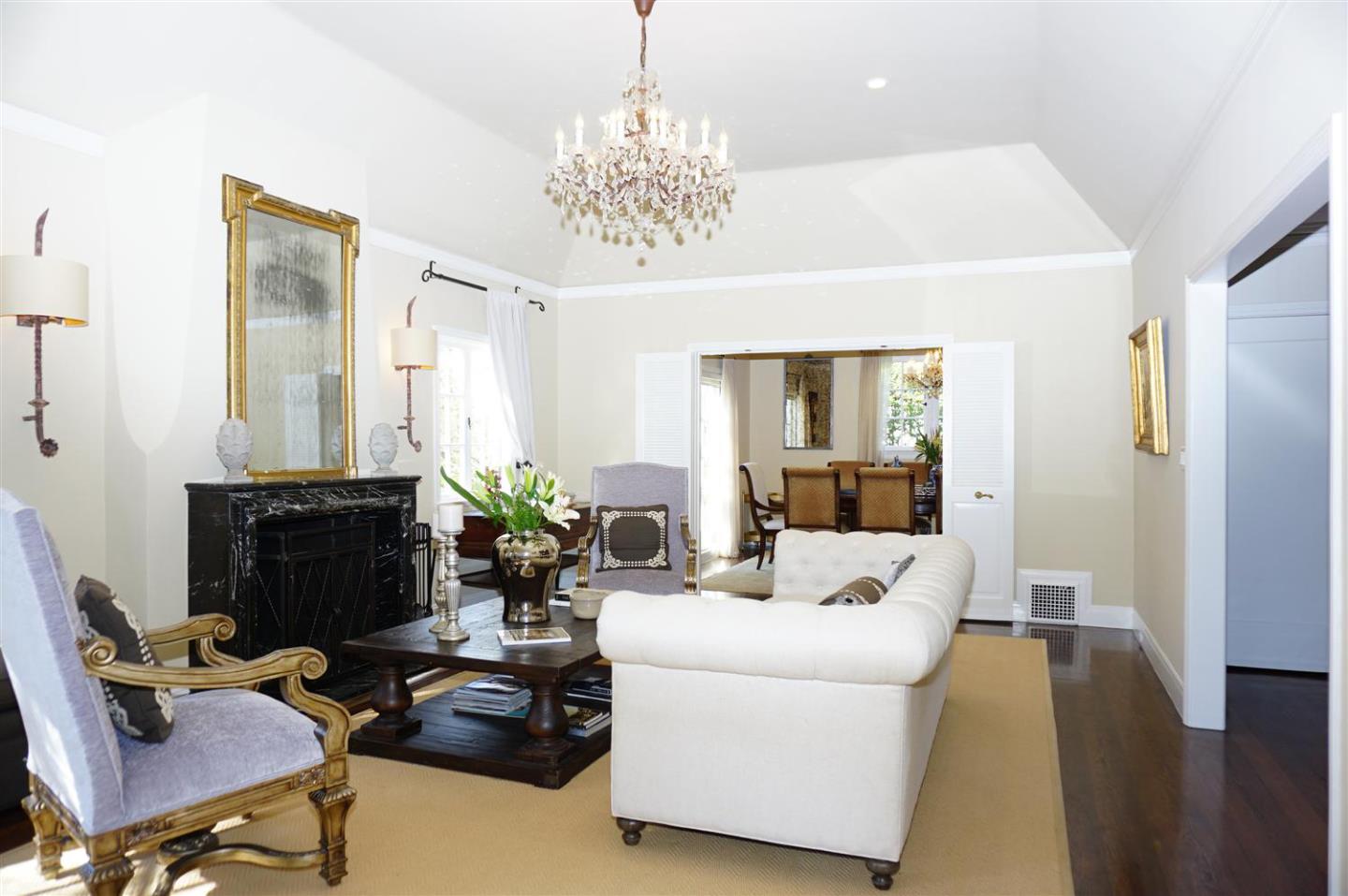 440 Edgewood Road San Mateo, CA 94402 - Photo 11 of 39 a living room with furniture and a chandelier