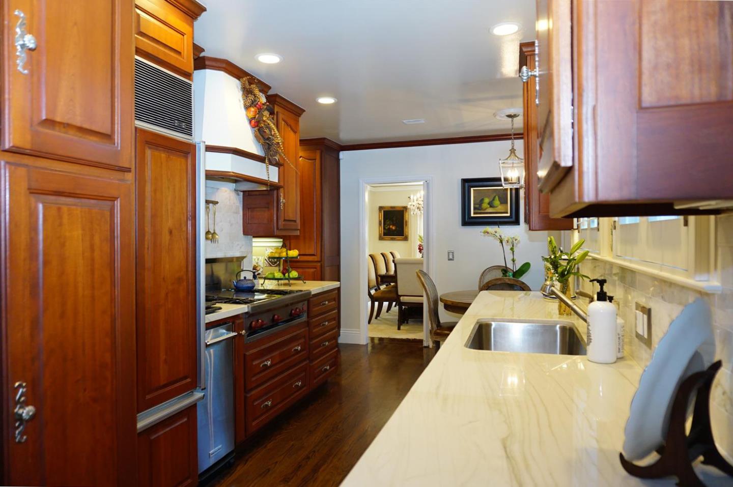 440 Edgewood Road San Mateo, CA 94402 - Photo 17 of 39 a kitchen with sink refrigerator and cabinets