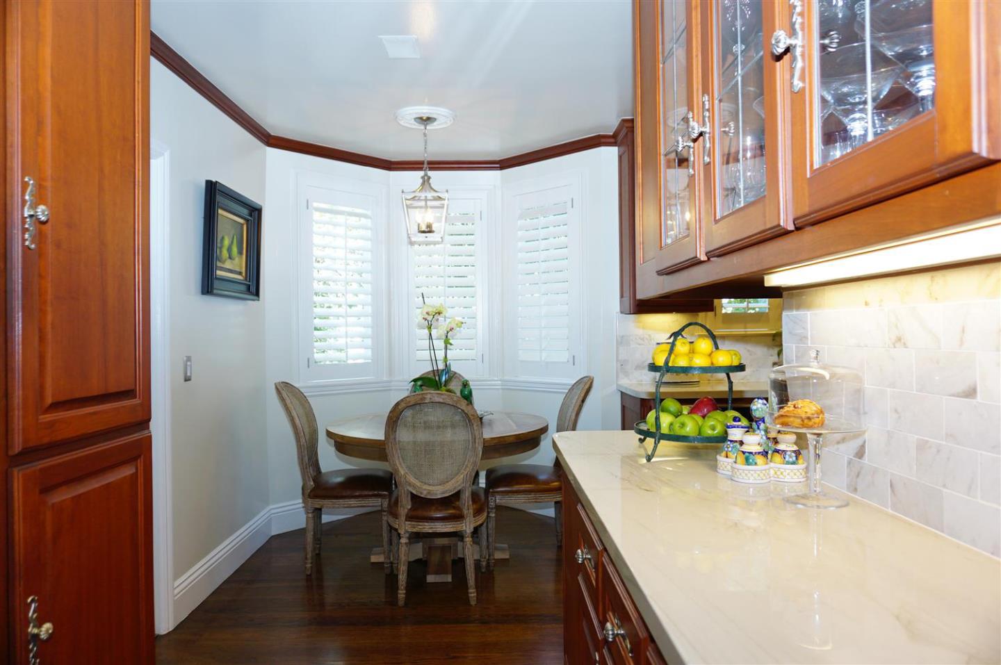 440 Edgewood Road San Mateo, CA 94402 - Photo 18 of 39 a view of a dining room with furniture and a window