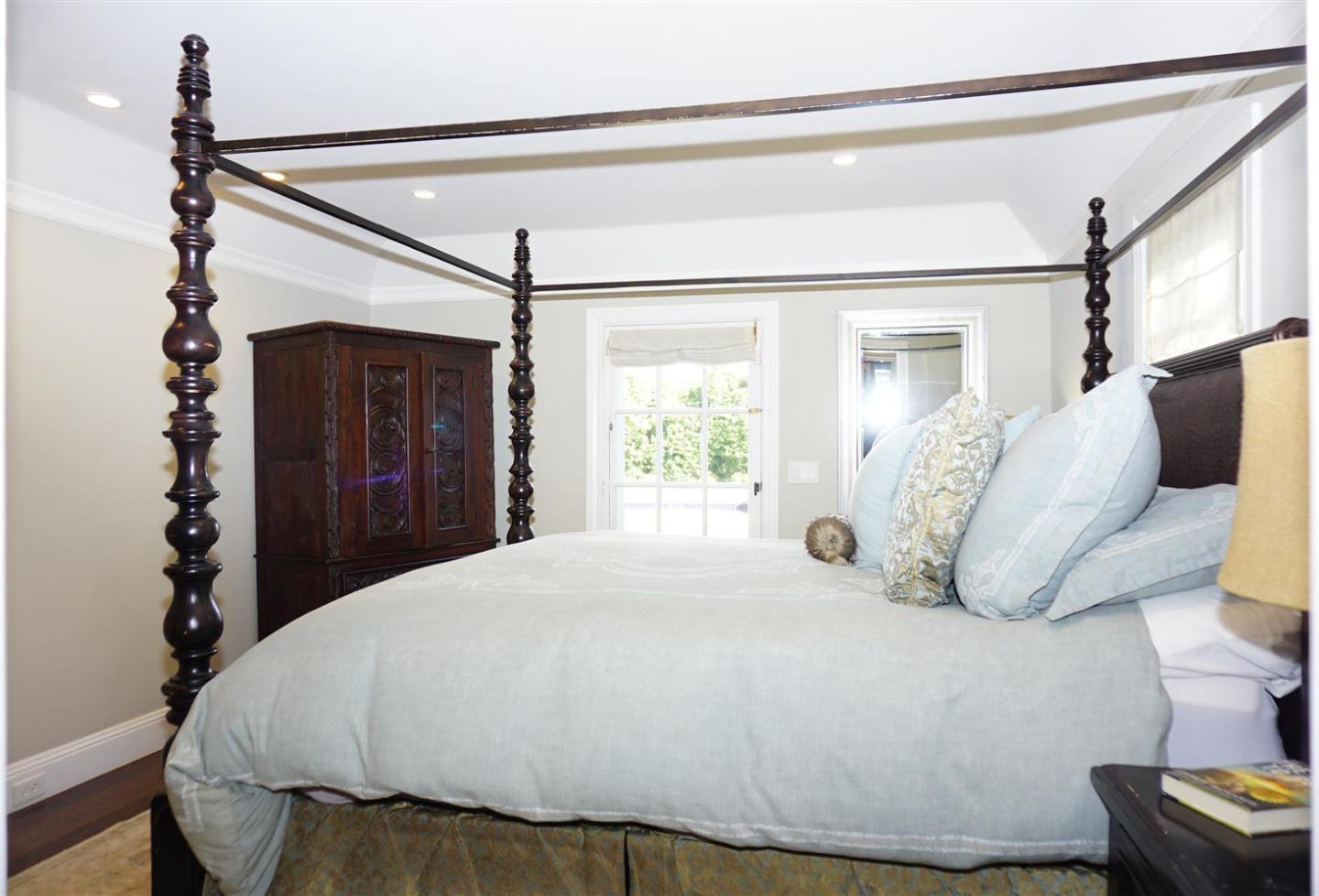 440 Edgewood Road San Mateo, CA 94402 - Photo 19 of 39 a large bed sitting in a bedroom next to a window