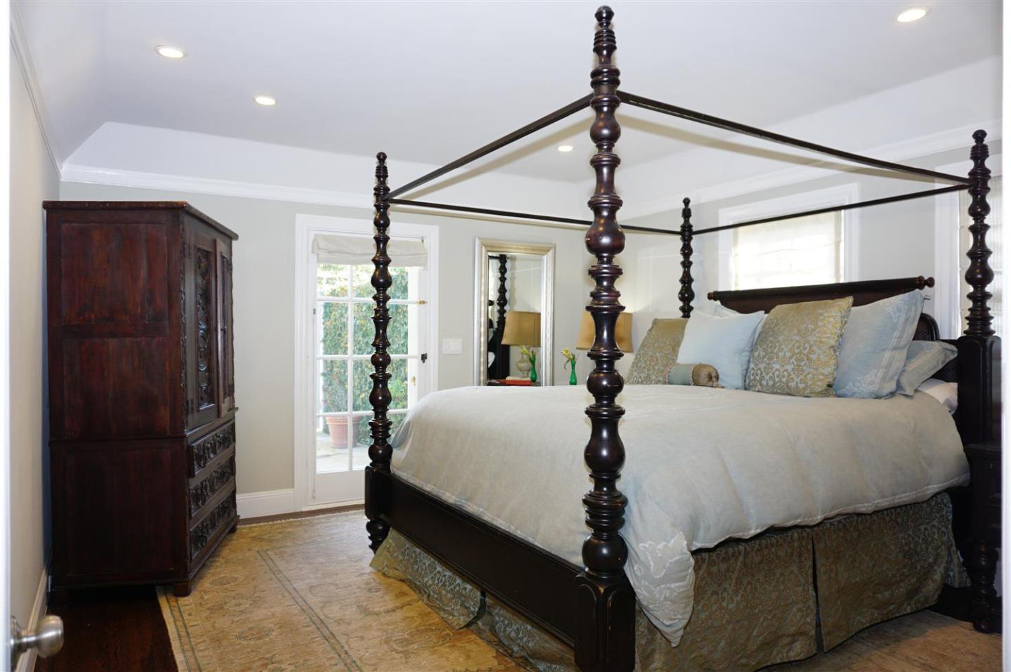 440 Edgewood Road San Mateo, CA 94402 - Photo 21 of 39 a bed room with a bed and a mirror