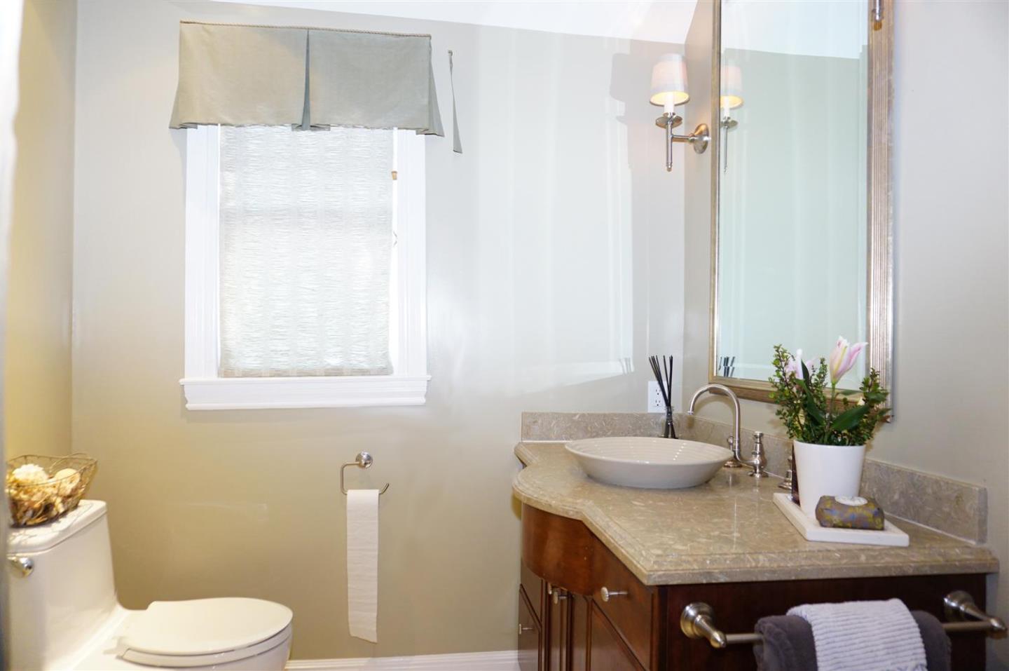 440 Edgewood Road San Mateo, CA 94402 - Photo 23 of 39 a bathroom with a sink toilet and a mirror