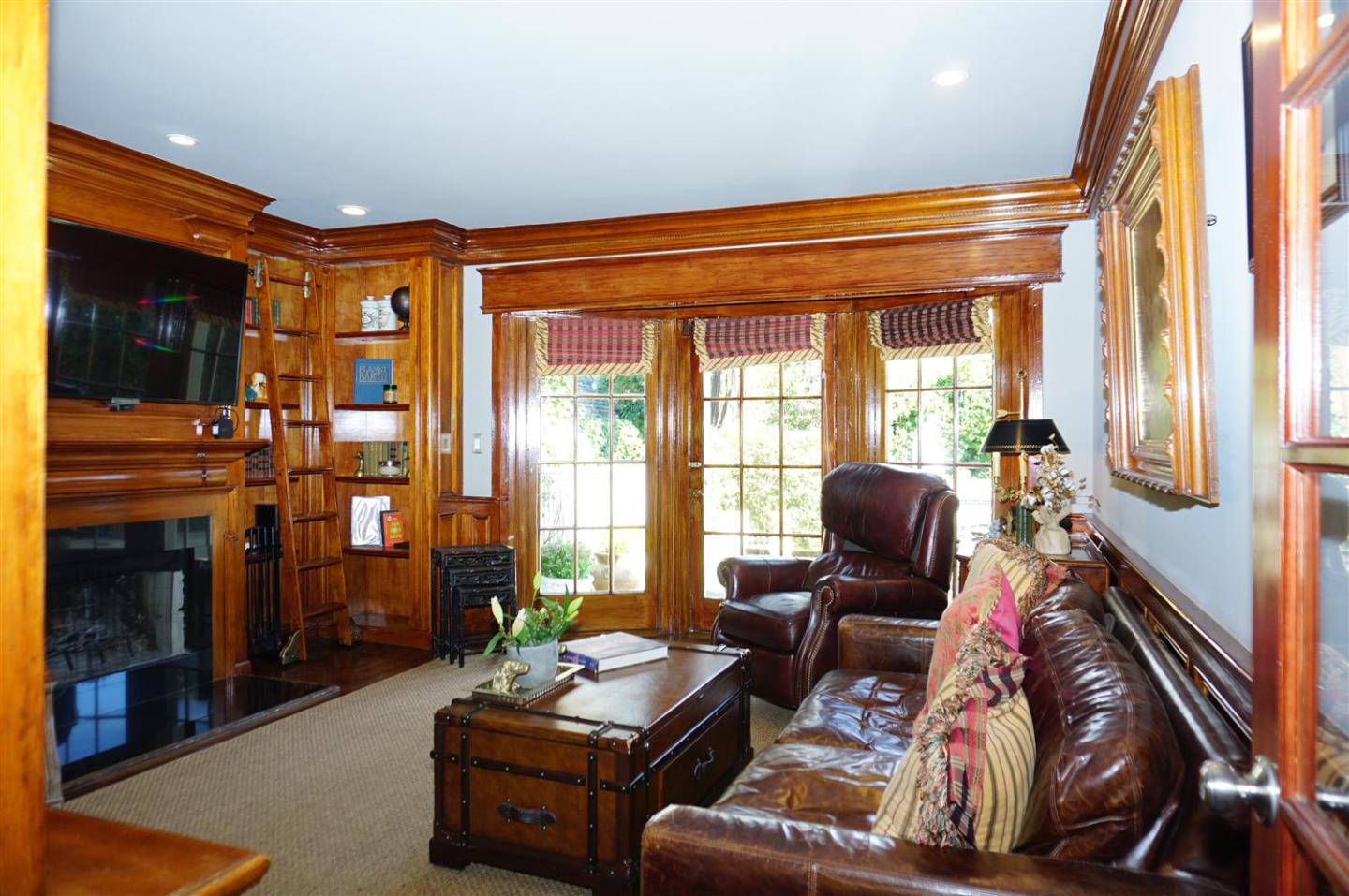 440 Edgewood Road San Mateo, CA 94402 - Photo 25 of 39 a living room with furniture and a flat screen tv