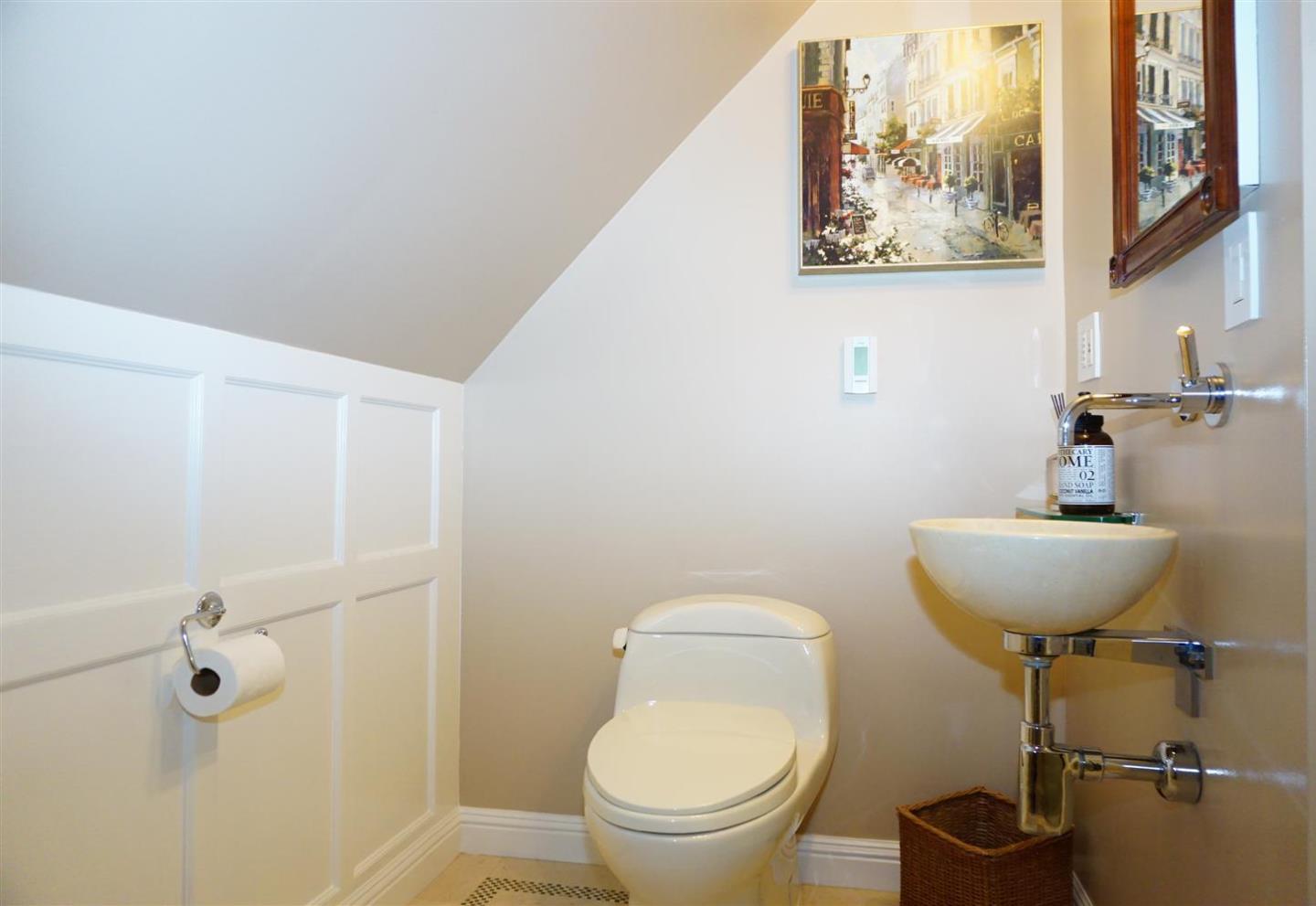 440 Edgewood Road San Mateo, CA 94402 - Photo 31 of 39 a bathroom with a toilet and a sink