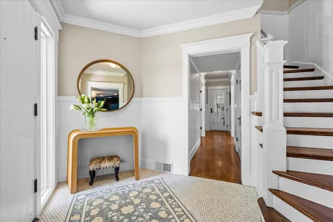 a bedroom with a bed and a mirror