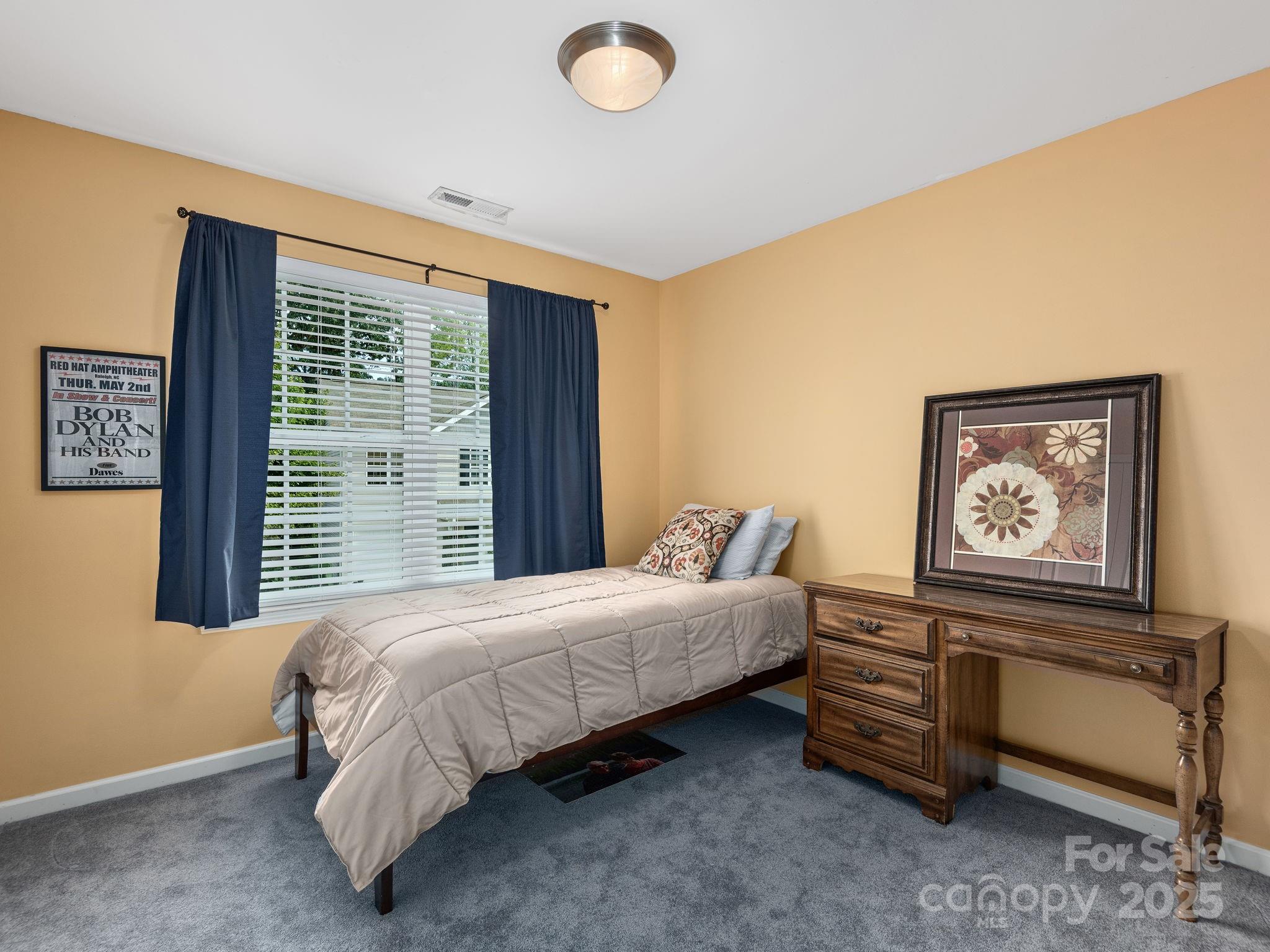 158 Alpine Ridge Drive Asheville, NC 28803 - Photo 12 of 18 a bedroom with a bed and a window