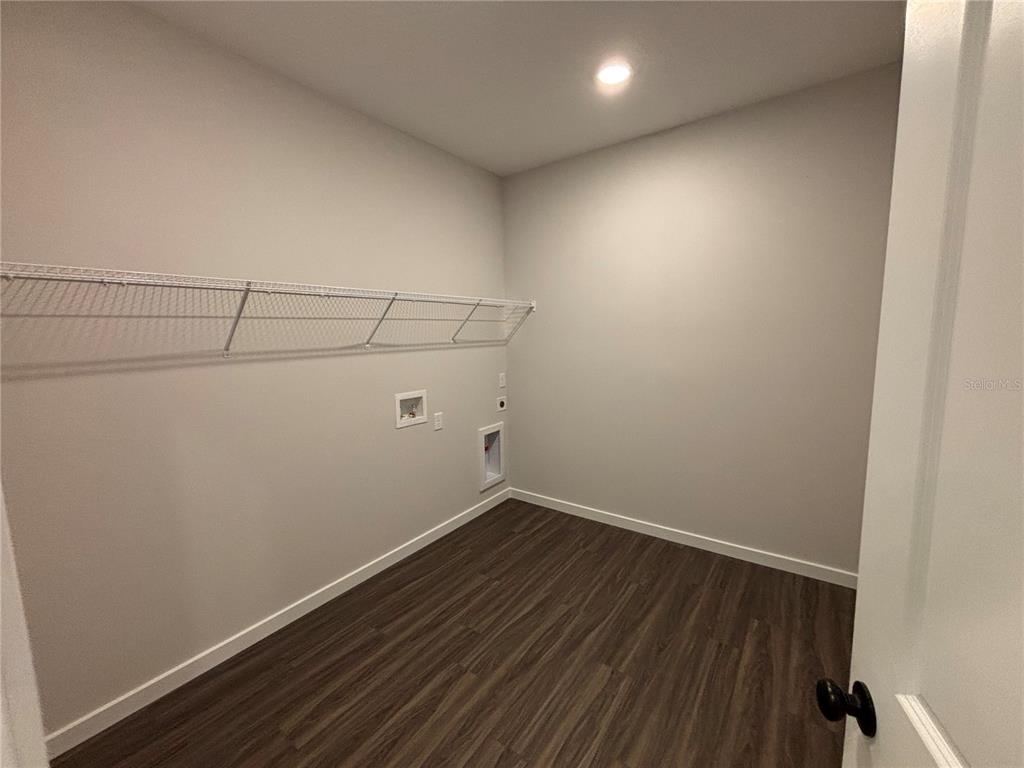 63 Pegasus Road Flagler Beach, FL 32136 - Photo 14 of 35 a view of a room with wooden floor