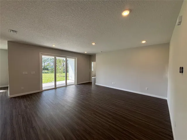 a view of a kitchen with wooden floor