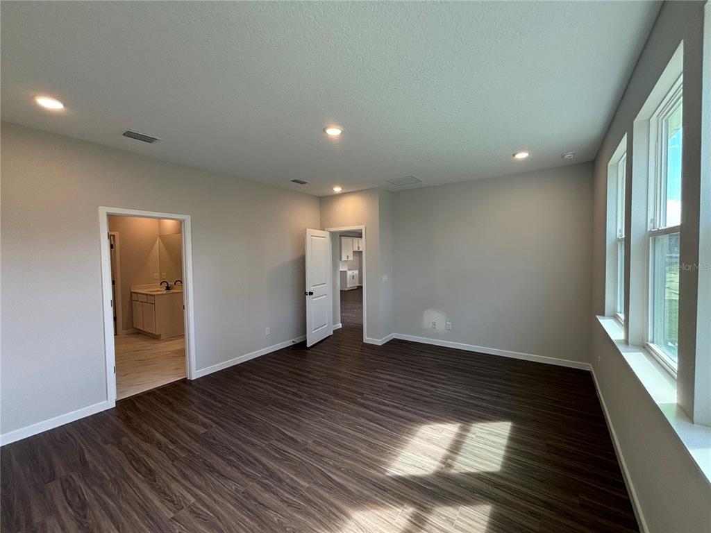 63 Pegasus Road Flagler Beach, FL 32136 - Photo 27 of 35 a view of an empty room with wooden floor and a window