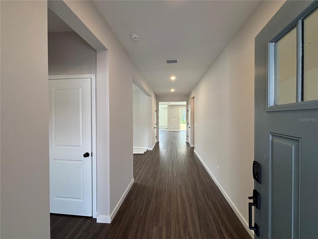 63 Pegasus Road Flagler Beach, FL 32136 - Photo 7 of 35 a view of a hallway with wooden floor