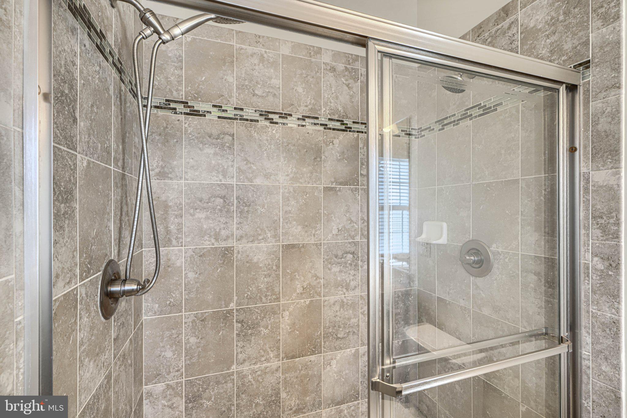 7336 Summit Rock Road Elkridge, MD 21075 - Photo 45 of 46 Sleek modern shower with elegant tiles.