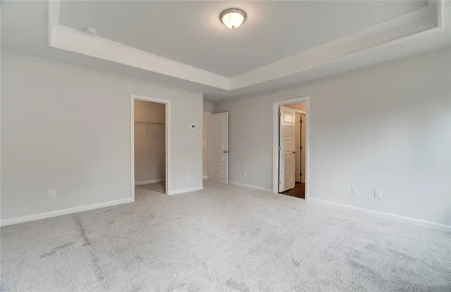 a view of an empty room and closet area