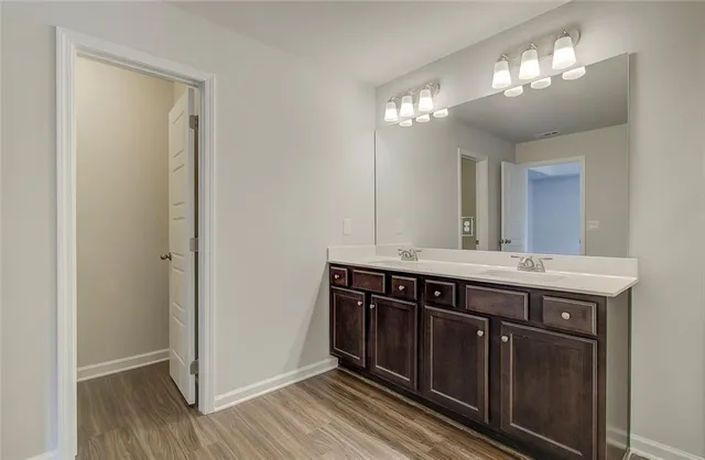 a view of a kitchen from a hallway
