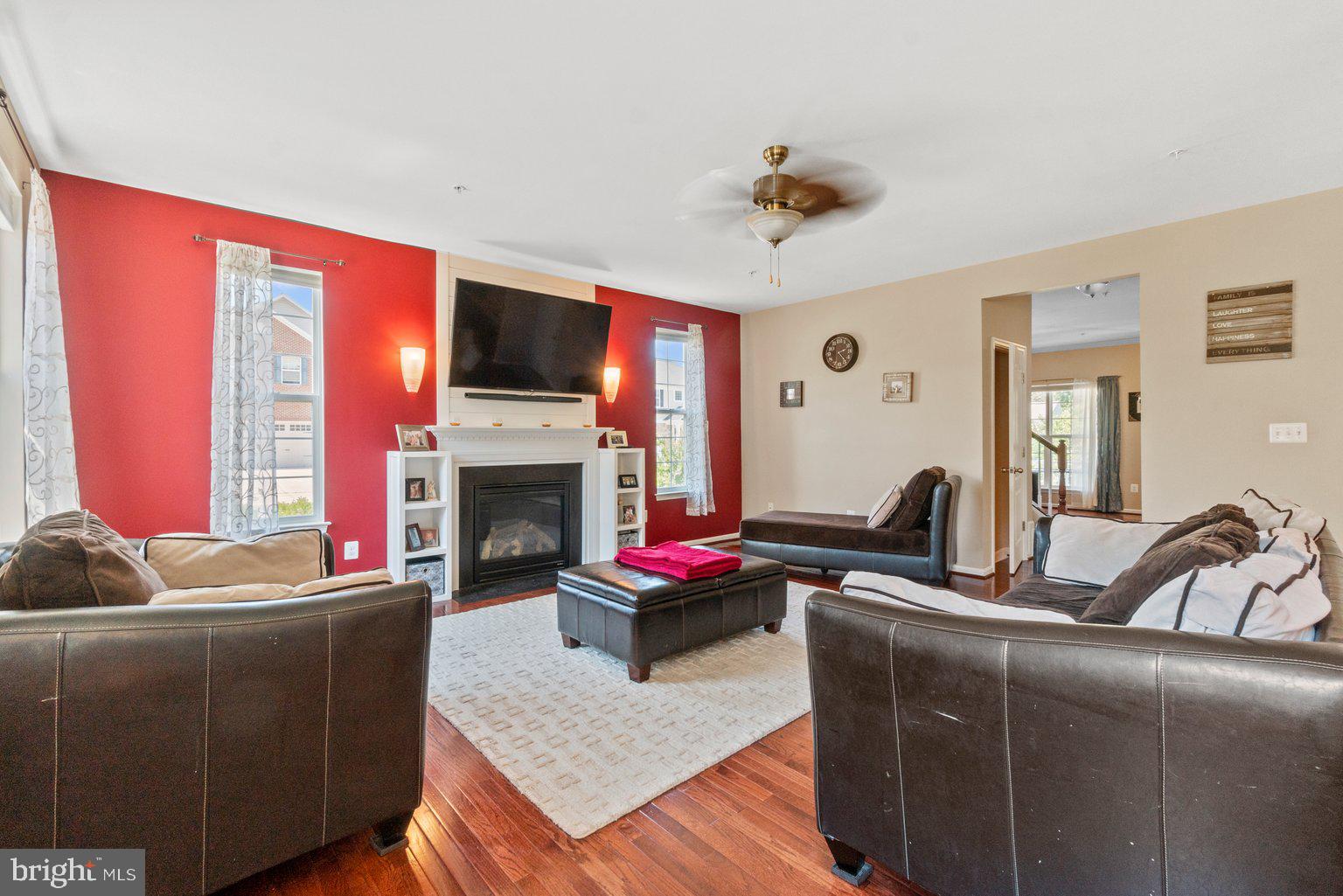 900 McCune Road Middle River, MD 21220 - Photo 11 of 55 a living room with furniture a flat screen tv and a fireplace