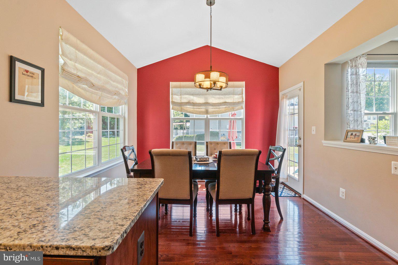 900 McCune Road Middle River, MD 21220 - Photo 18 of 55 a view of a dining room with furniture window and wooden floor