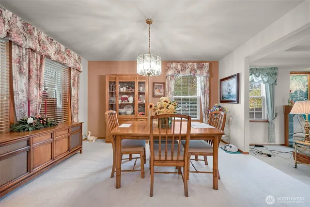a view of a dining room with furniture window and outside view