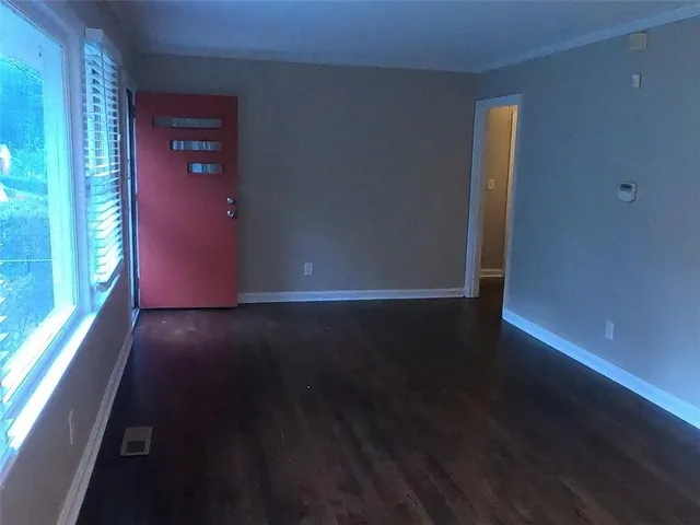 a view of an empty room with a window