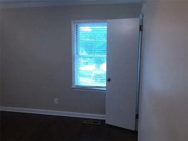 an empty room with closet area