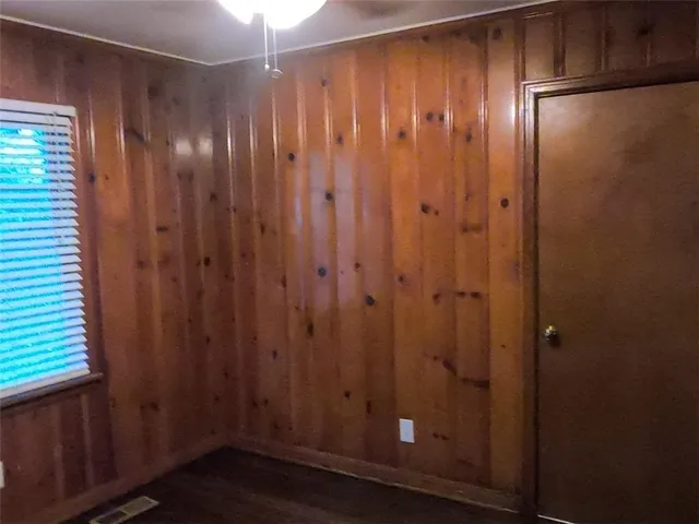 a view of hallway with wooden floor