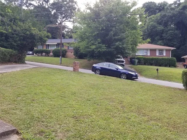 a backyard of a house with lots of green space