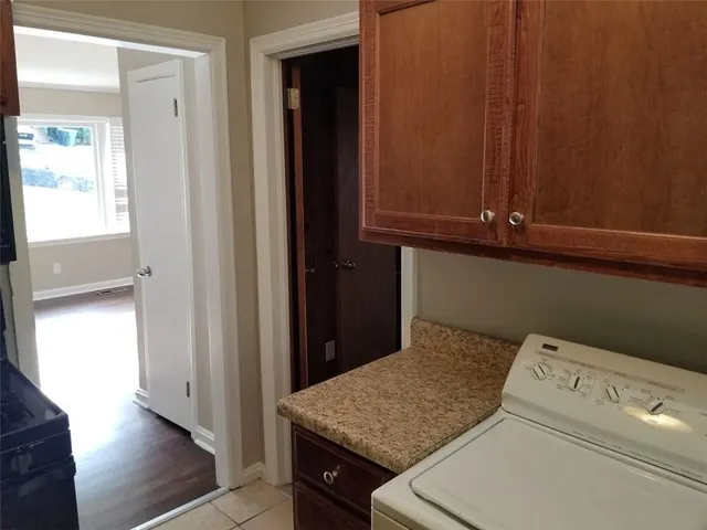 a kitchen with a stove and a refrigerator