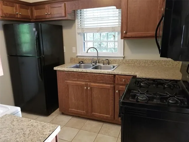 a view of a two chairs in a backyard