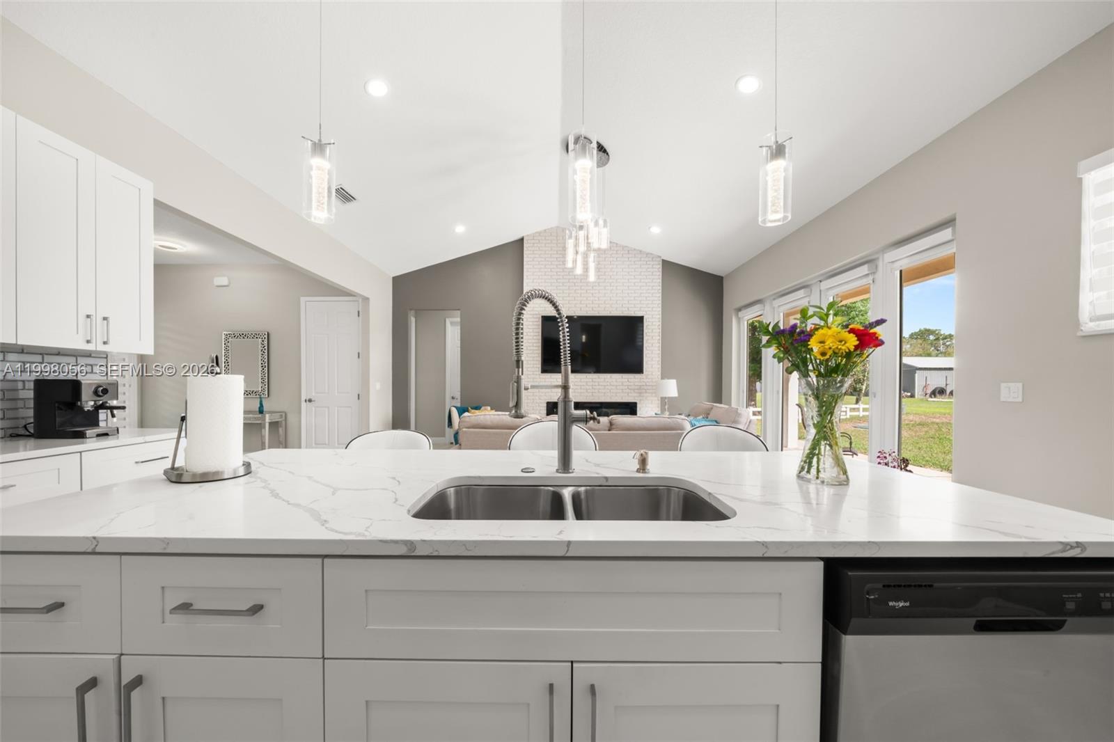 2009 Flower Sebring, FL 33875 - Photo 11 of 61 a kitchen with sink and center island