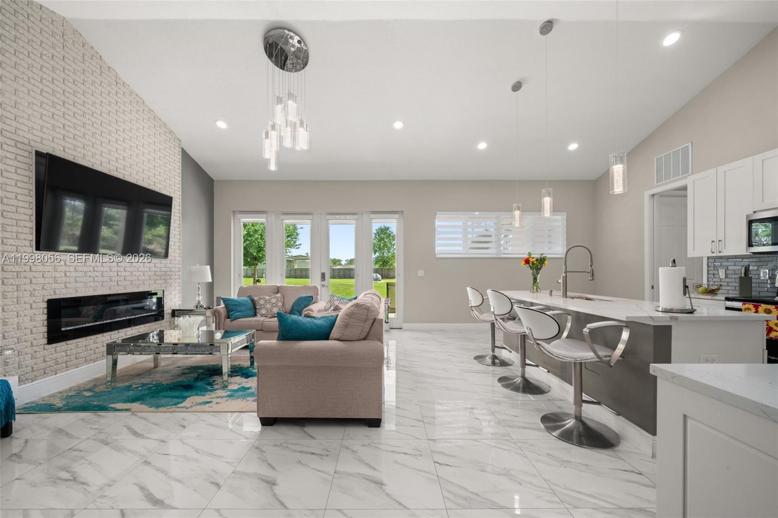 2009 Flower Sebring, FL 33875 - Photo 14 of 61 a living room with furniture and a flat screen tv