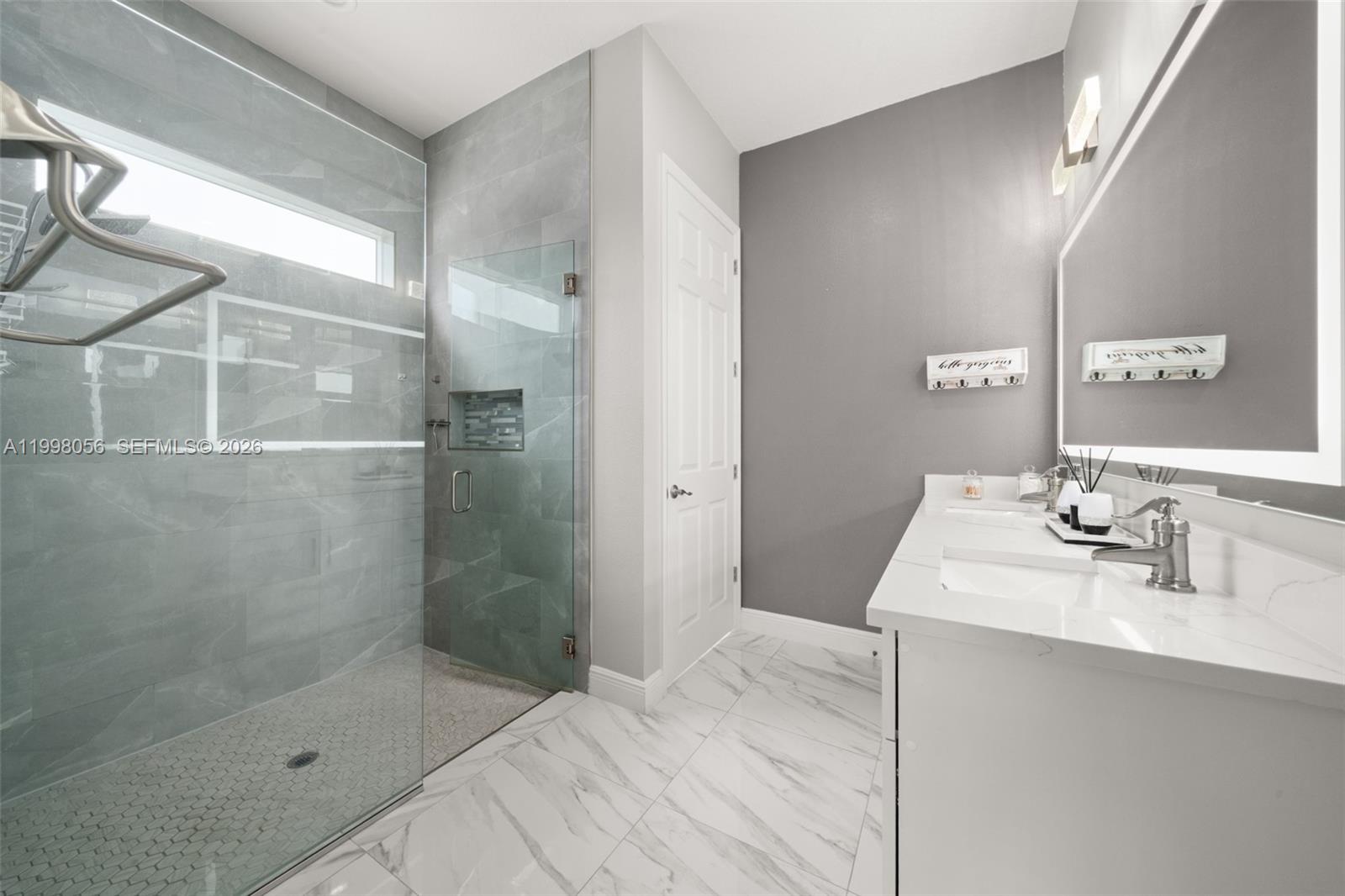 2009 Flower Sebring, FL 33875 - Photo 26 of 61 a bathroom with a sink shower and a mirror