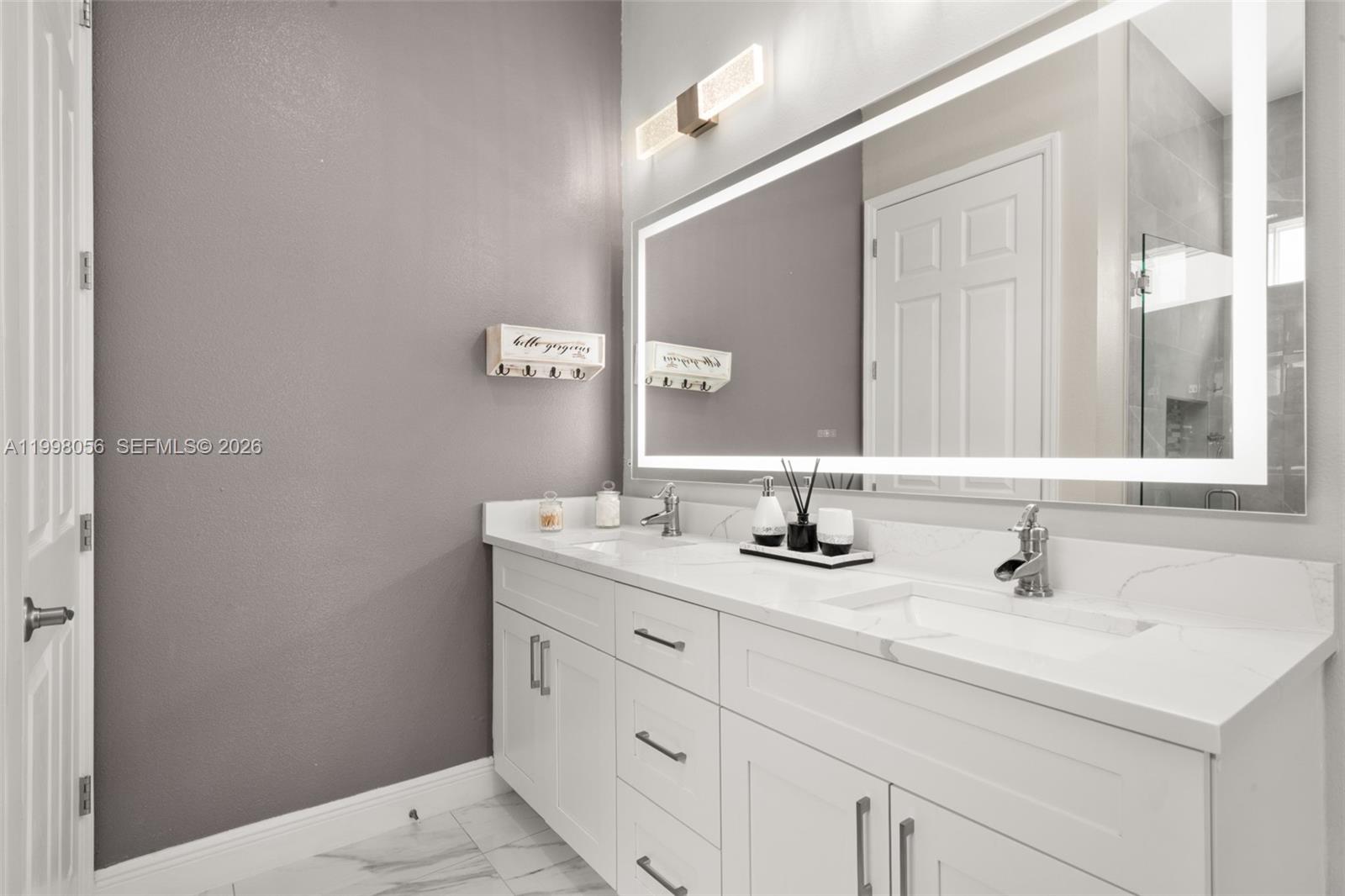 2009 Flower Sebring, FL 33875 - Photo 27 of 61 a bathroom with a sink and a mirror