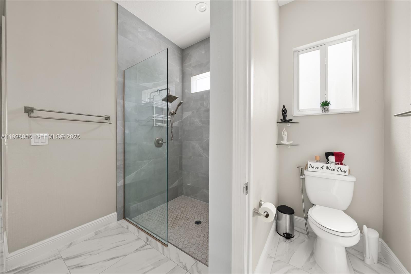 2009 Flower Sebring, FL 33875 - Photo 28 of 61 a bathroom with a toilet and a shower