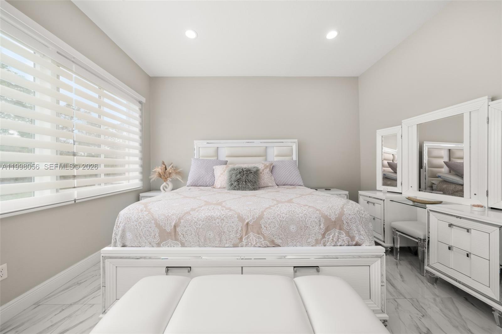 2009 Flower Sebring, FL 33875 - Photo 31 of 61 a bedroom with a large bed and a window