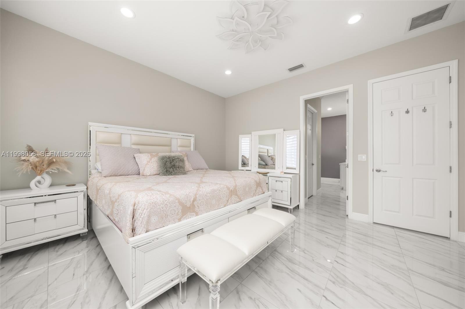 2009 Flower Sebring, FL 33875 - Photo 32 of 61 a bedroom with a bed and a table