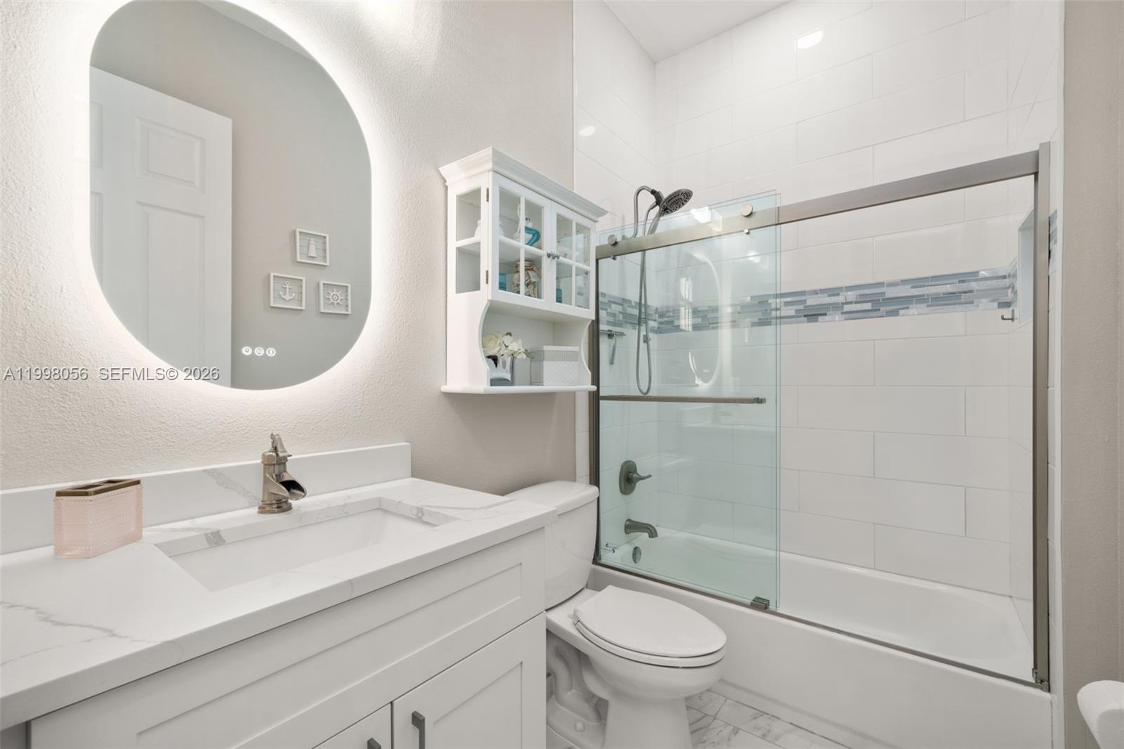 2009 Flower Sebring, FL 33875 - Photo 35 of 61 a bathroom with a sink a toilet and shower