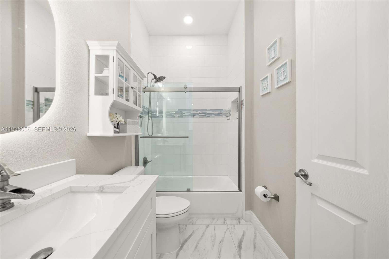 2009 Flower Sebring, FL 33875 - Photo 36 of 61 a bathroom with a sink a toilet and shower