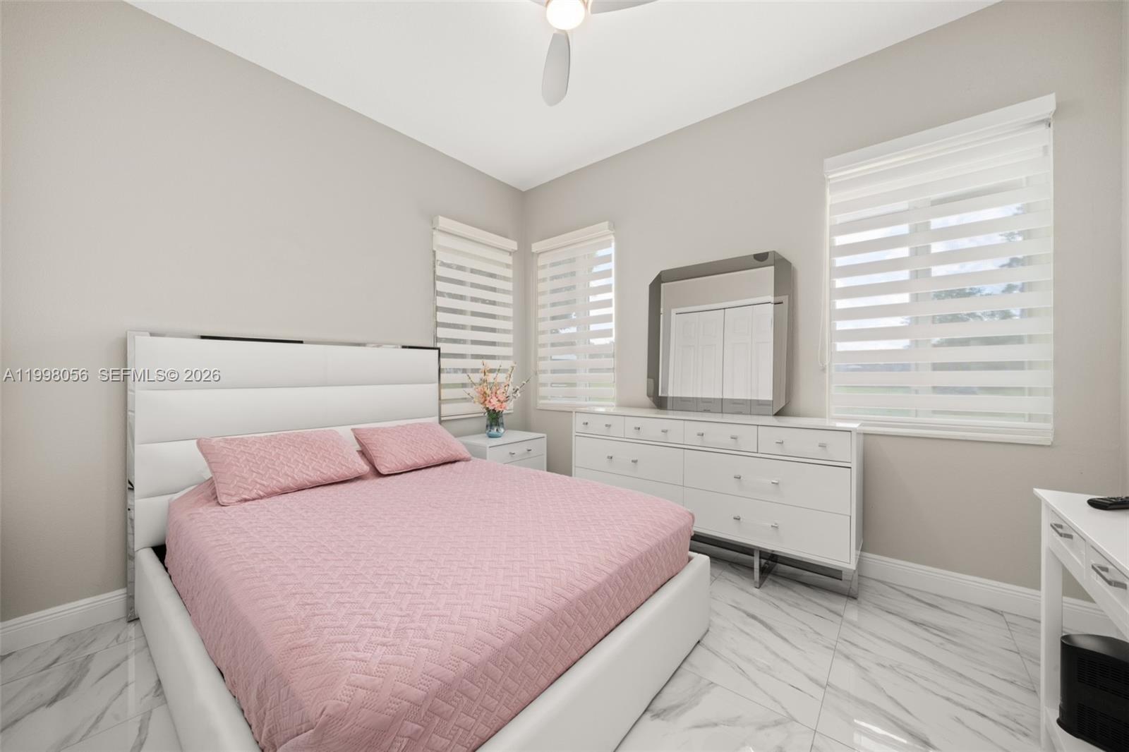 2009 Flower Sebring, FL 33875 - Photo 38 of 61 a bedroom with a bed and a window